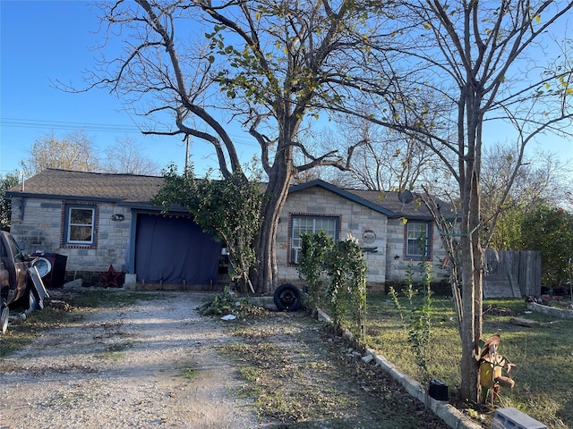 ranch-style home with a garage