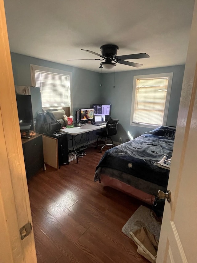 bedroom featuring ceiling fan and dark hardwood / wood-style floors