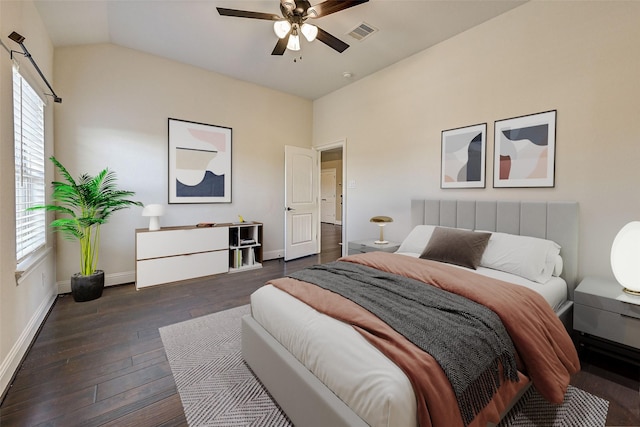 bedroom with dark hardwood / wood-style flooring, ceiling fan, and lofted ceiling