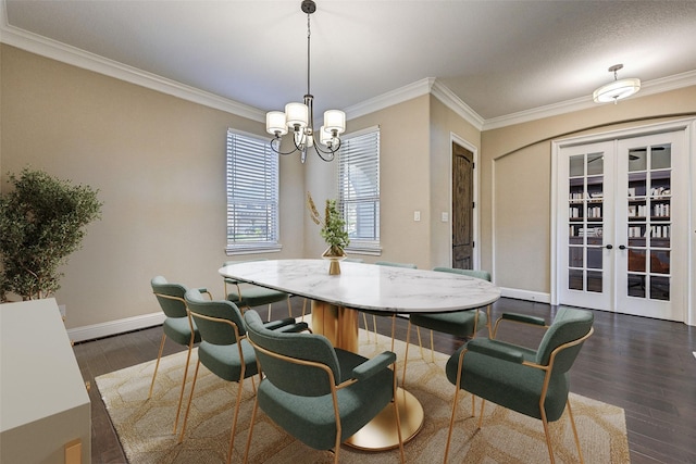 dining room featuring crown molding, french doors, dark hardwood / wood-style floors, and a notable chandelier