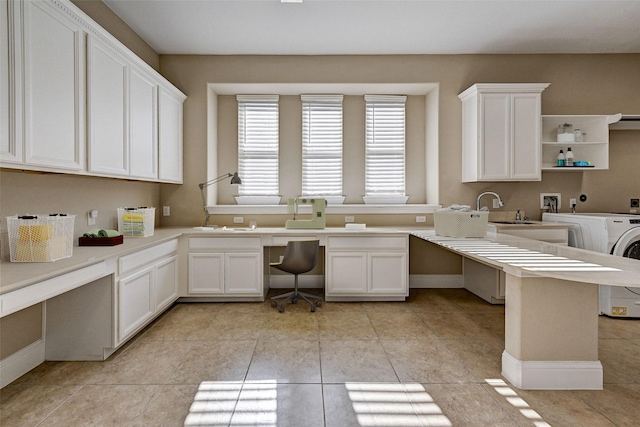 unfurnished office with sink and light tile patterned flooring