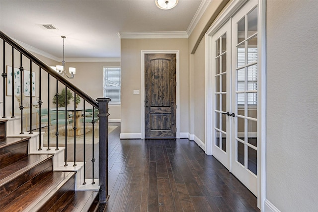 entryway featuring french doors, dark wood-type flooring, and crown molding