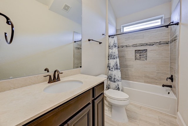 full bathroom featuring tile patterned floors, shower / tub combo with curtain, vanity, and toilet