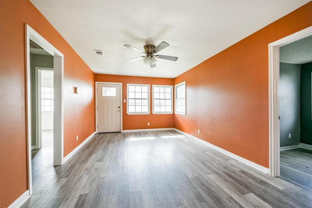 foyer featuring hardwood / wood-style flooring and ceiling fan