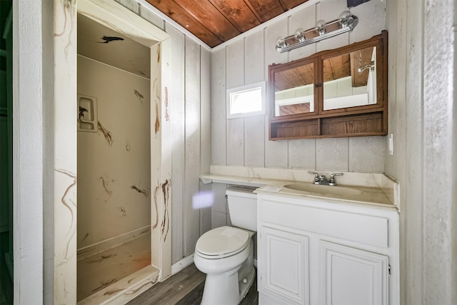 bathroom with wood walls, toilet, vanity, wood ceiling, and hardwood / wood-style flooring