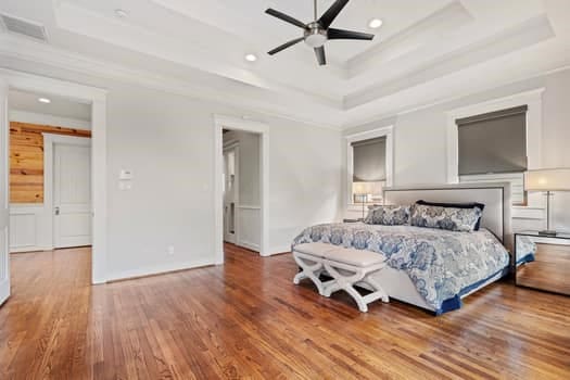 1148 Nicholson St, Houston, TX 77008 - bedroom with a raised ceiling, recessed lighting, wood finished floors, and visible vents