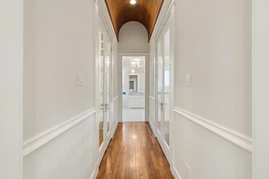 1148 Nicholson St, Houston, TX 77008 - hall with french doors, vaulted ceiling, and wood finished floors