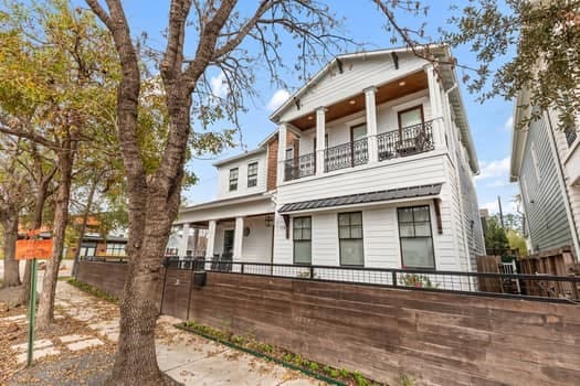 view of front of house with a balcony