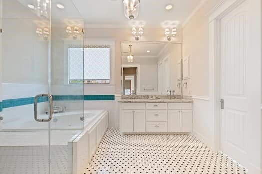 1148 Nicholson St, Houston, TX 77008 - full bathroom featuring double vanity, a garden tub, crown molding, an enclosed shower, and tile patterned floors