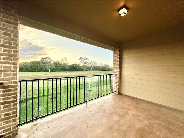 view of balcony at dusk