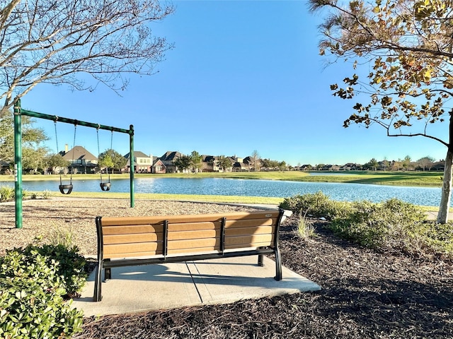 surrounding community featuring a water view