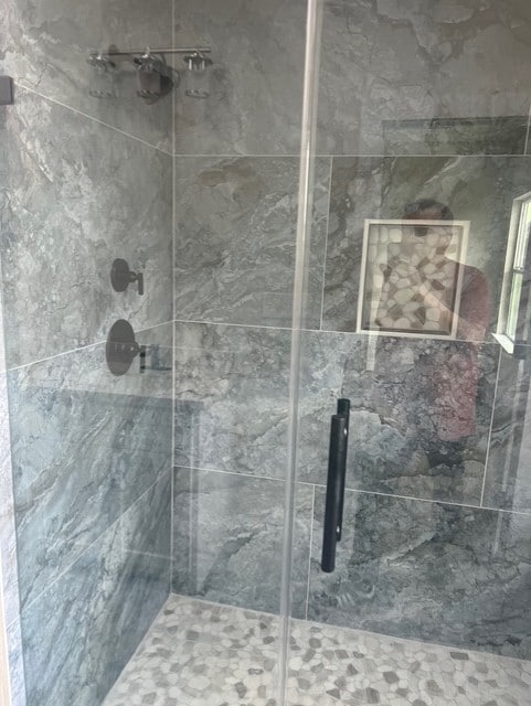 full bath featuring a stall shower