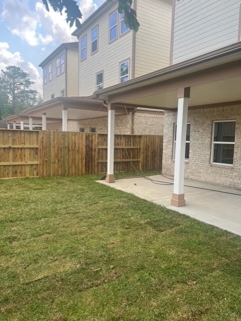 view of yard featuring a patio area and fence