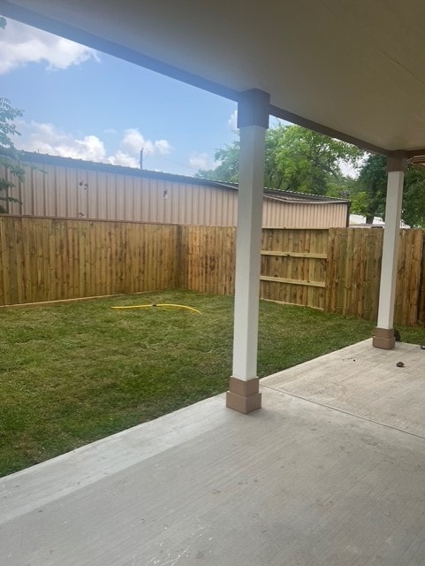 view of yard with a patio and a fenced backyard