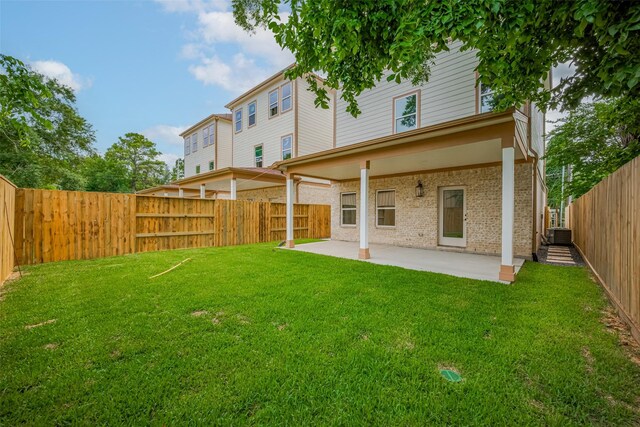 2206 Hoskins Dr, Houston, TX 77080 - back of property with a patio area and brick siding