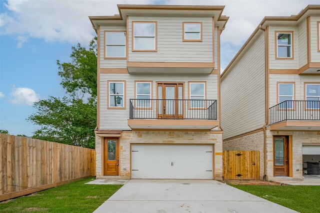 2206 Hoskins Dr, Houston, TX 77080 - view of property with stone siding, driveway, a garage, and a balcony
