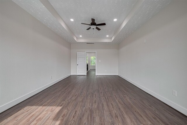 2206 Hoskins Dr, Houston, TX 77080 - empty room with ceiling fan, wood finished floors, baseboards, a tray ceiling, and recessed lighting