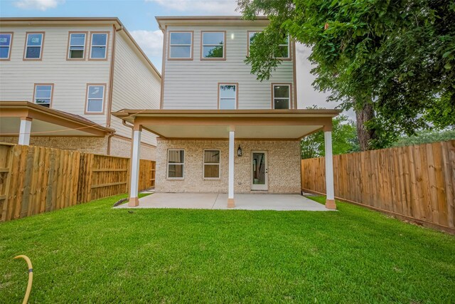 2206 Hoskins Dr, Houston, TX 77080 - rear view of house with a patio area and brick siding