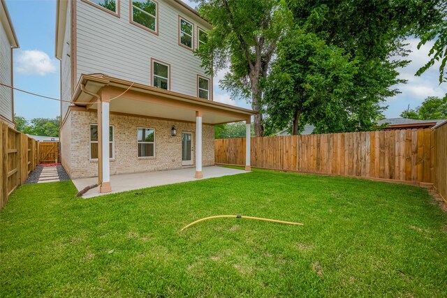 2206 Hoskins Dr, Houston, TX 77080 - back of property with a patio and brick siding