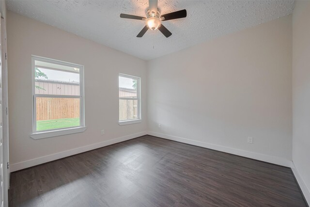 2206 Hoskins Dr, Houston, TX 77080 - unfurnished room with dark wood-style floors, a textured ceiling, healthy amount of natural light, baseboards, and a ceiling fan