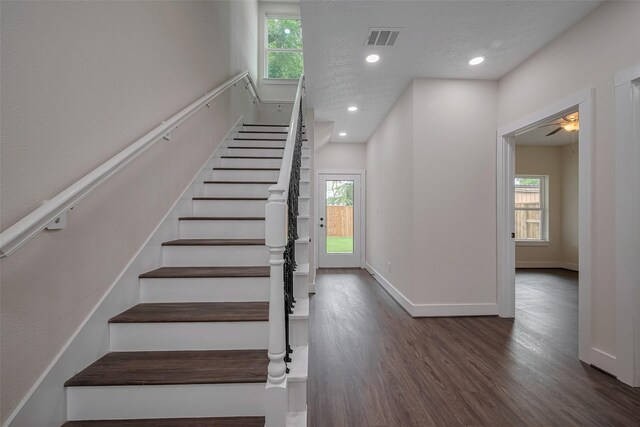 2206 Hoskins Dr, Houston, TX 77080 - staircase with wood finished floors, plenty of natural light, recessed lighting, and baseboards