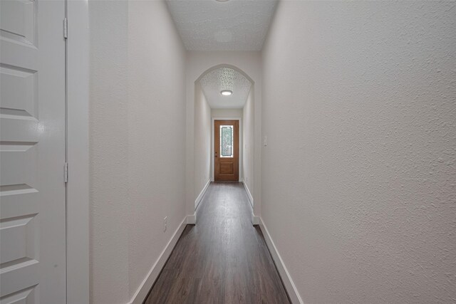 2206 Hoskins Dr, Houston, TX 77080 - entryway with baseboards, dark wood-type flooring, and arched walkways
