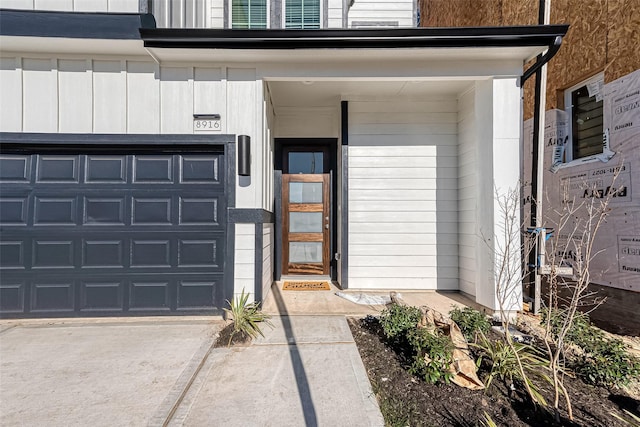 doorway to property featuring a garage