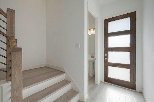 foyer entrance featuring light hardwood / wood-style flooring