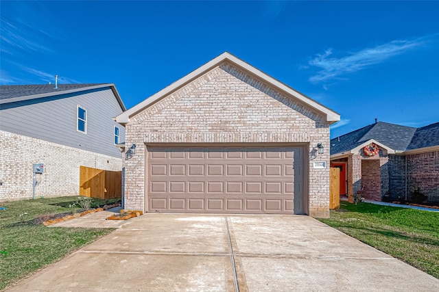 view of front of home with an outbuilding, a garage, and a front lawn