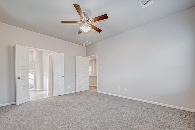 unfurnished bedroom featuring light colored carpet and ceiling fan