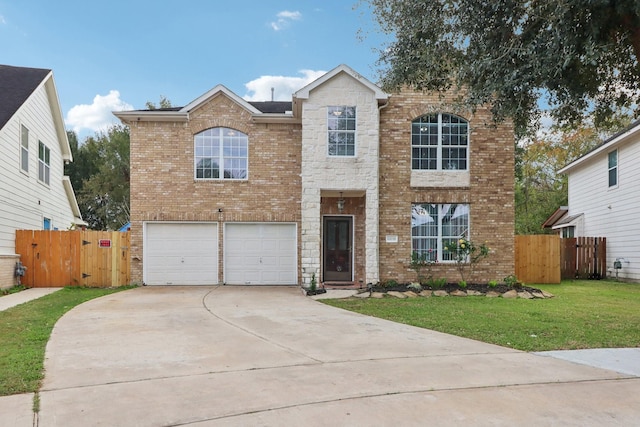 view of front of home featuring a front yard and a garage