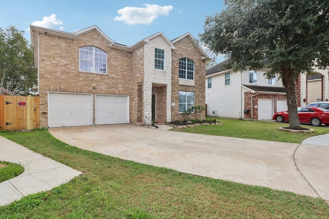 front of property featuring a front yard and a garage