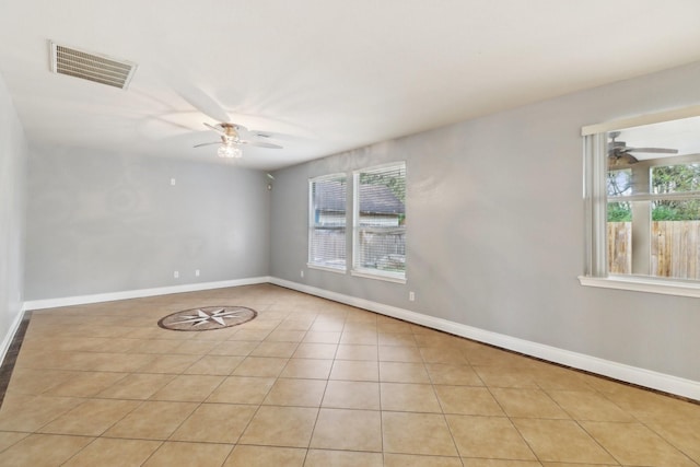 spare room with light tile patterned floors