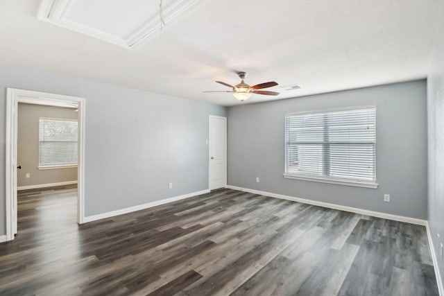 empty room featuring dark hardwood / wood-style floors and ceiling fan