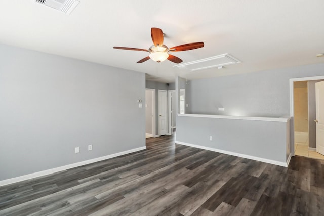 unfurnished room featuring ceiling fan and dark wood-type flooring