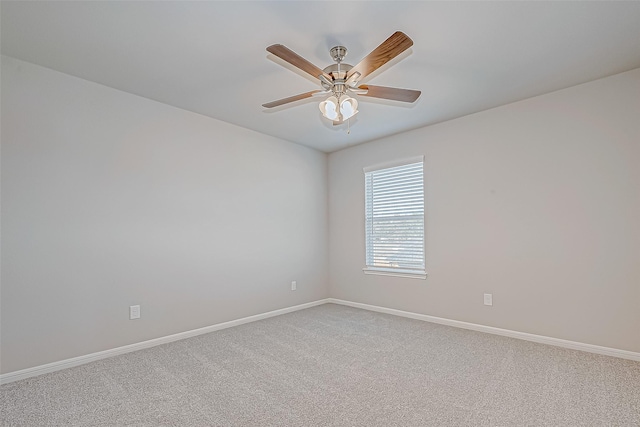 unfurnished room with ceiling fan and carpet floors