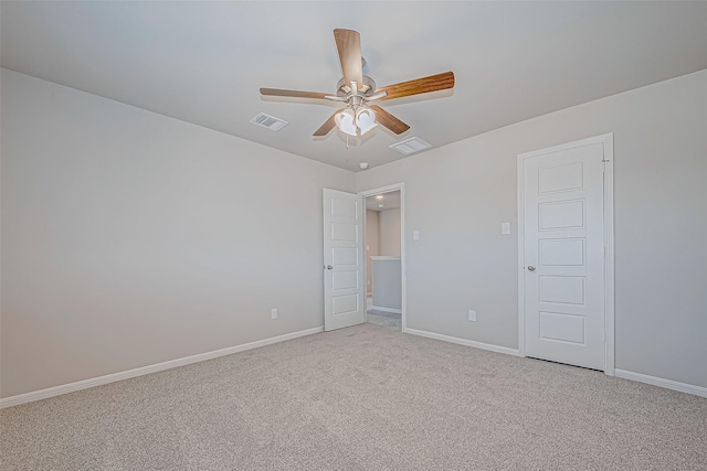 unfurnished room featuring light colored carpet and ceiling fan