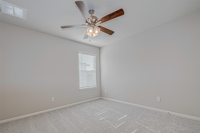 empty room featuring light carpet and ceiling fan