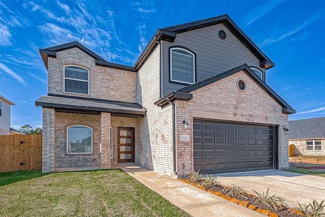 front facade featuring a garage and a front lawn