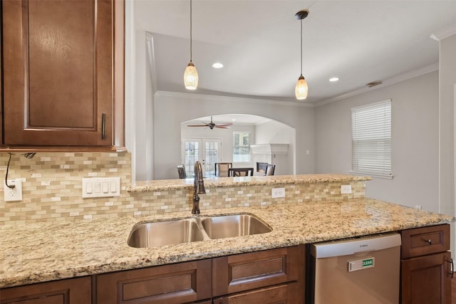 kitchen featuring decorative backsplash, stainless steel dishwasher, ceiling fan, crown molding, and sink