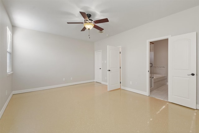 unfurnished bedroom with ensuite bathroom and ceiling fan