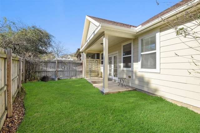 view of yard with a patio and french doors