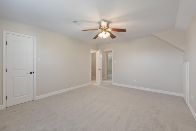 additional living space featuring ceiling fan and light colored carpet