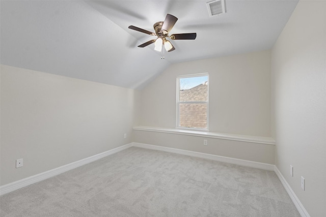 bonus room with ceiling fan, light colored carpet, and lofted ceiling