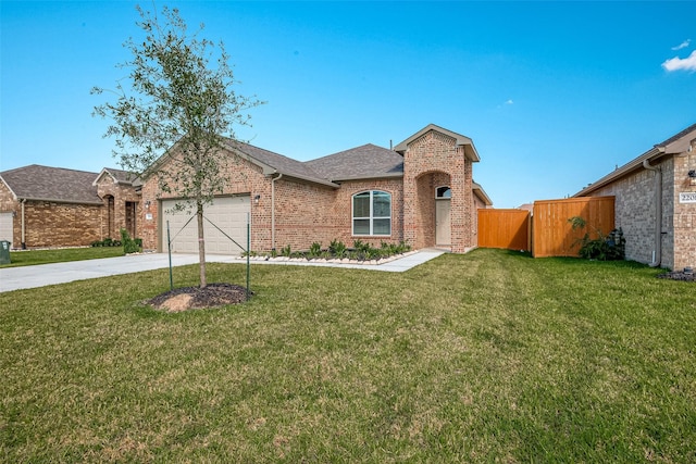 view of front of property featuring a garage and a front lawn