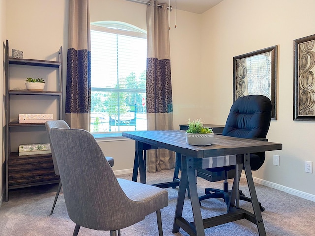 view of carpeted dining space