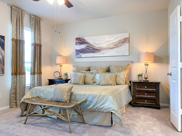 bedroom featuring ceiling fan and light carpet