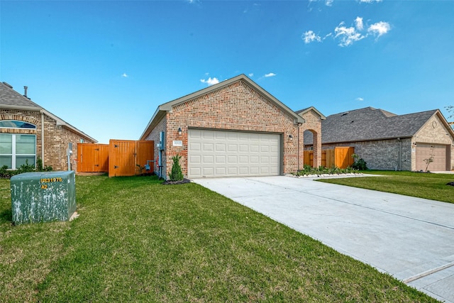 view of front of house with a garage and a front lawn