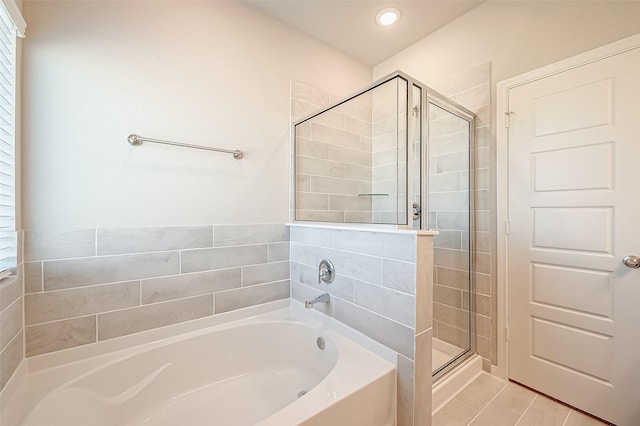 bathroom with tile patterned flooring and plus walk in shower