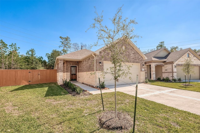 view of front of house with a front yard and a garage